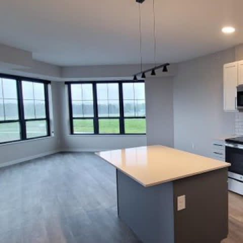 A kitchen with a large island in the middle of the room.