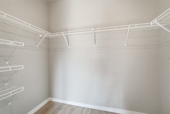 Empty white shelves in a room.