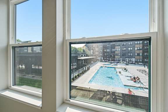 A view of a pool through a window.