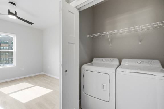 A laundry room with a washer and dryer in it.