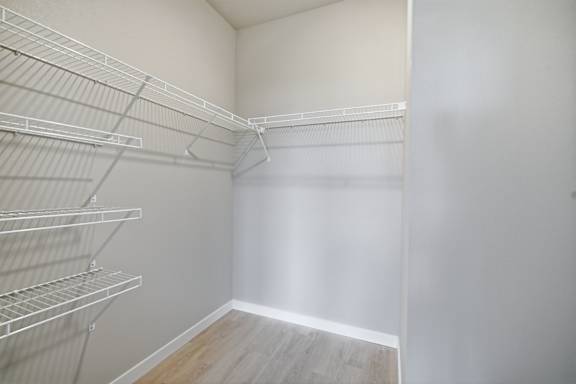 Empty white shelves in a room.