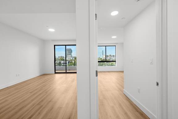 A room with wooden floors and white walls.