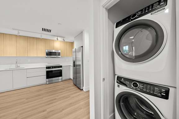 A modern laundry room with a washer and dryer.