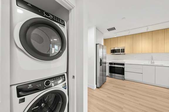 A modern laundry room with a washer and dryer.