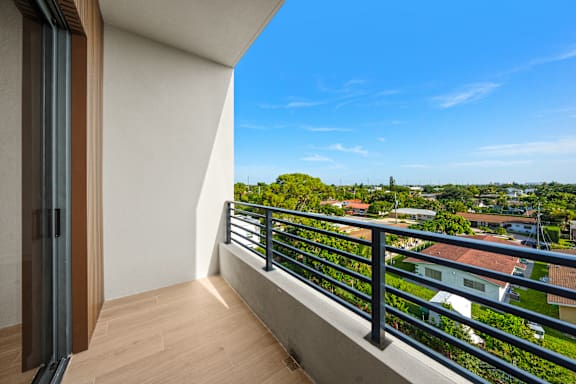 A balcony with a view of a residential area.