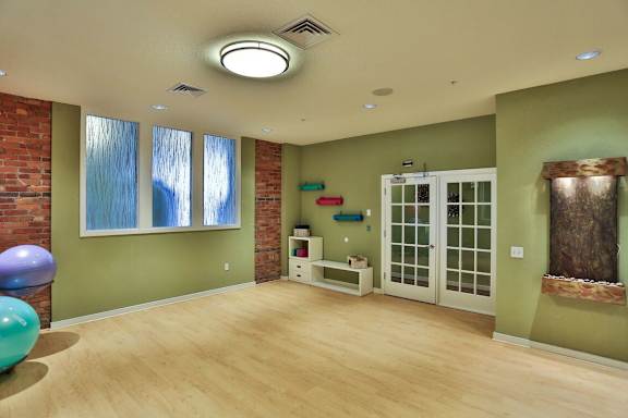 A room with a green wall and a white door.