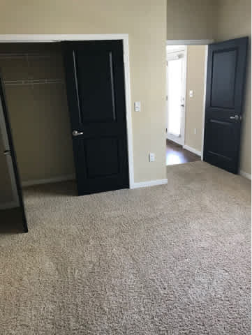 A hallway with two doors on either side.