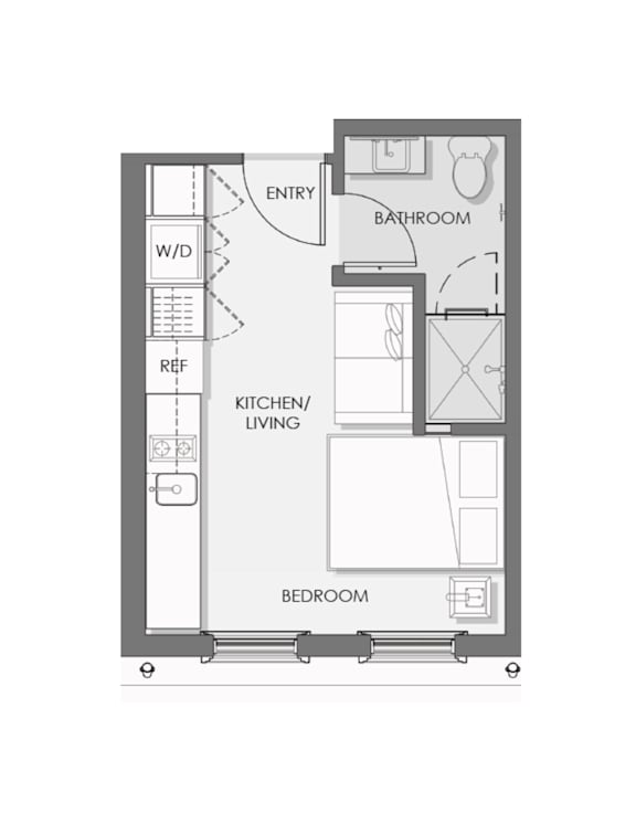 A floor plan of a small apartment with a bedroom, kitchen, and bathroom.