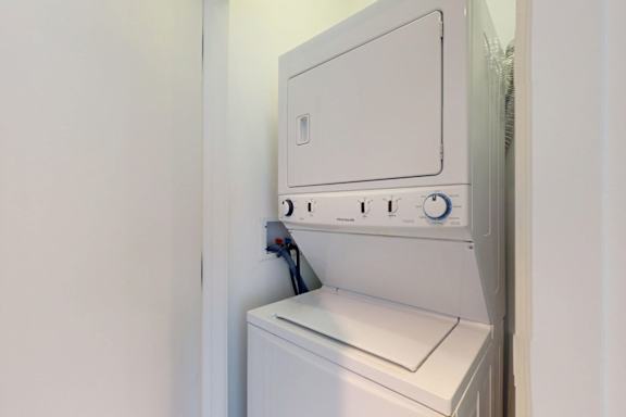 A white dishwasher is installed in a wall.
