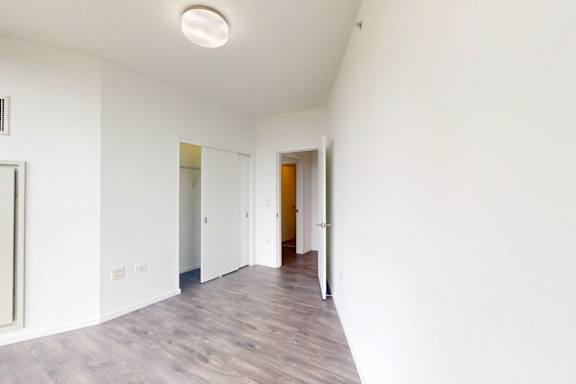 A long hallway with a door at the end.