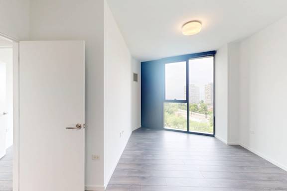 A white door is on the left and a black door is on the right.