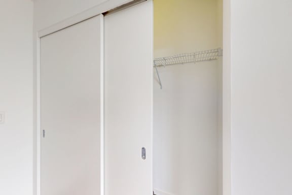 A white door with a silver handle is closed.