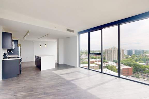 A modern kitchen with a view of the city.