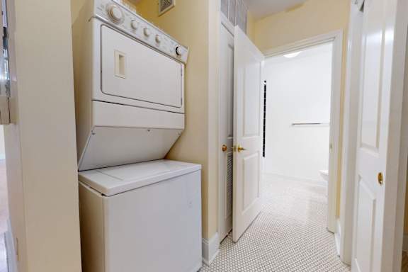 A white oven and dishwasher in a kitchen.