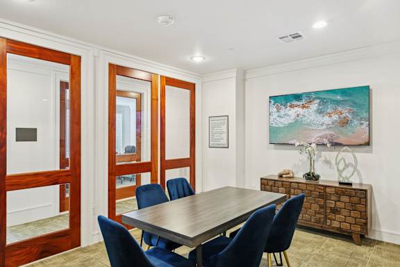 Dining Room with Wooden table and chairs at Harrisburg Lofts, Houston, TX