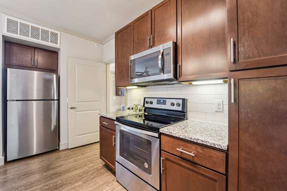 Kitchen with stove top oven at Kings Landing, Texas, 77339