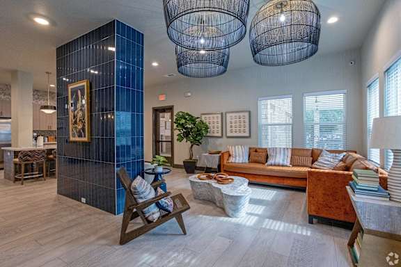A living room with a blue wall and a wooden chair.