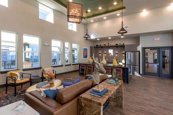 A living room with a brown couch and a coffee table.