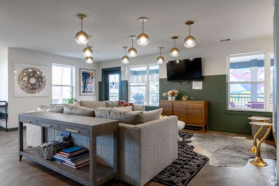 A living room with a grey sofa and a coffee table.