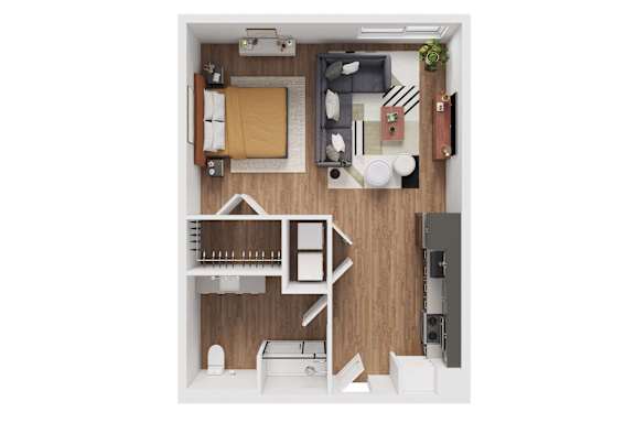 A top-down view of a small apartment with a bed, desk, and kitchenette.