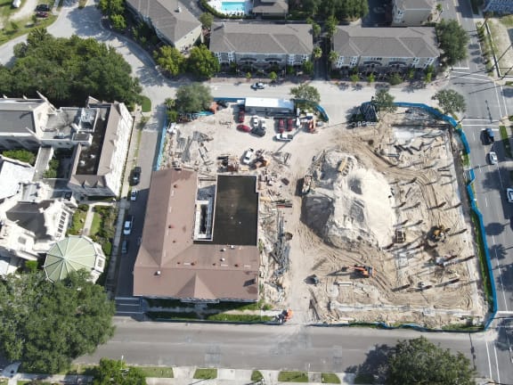 an aerial view of a building under construction in a residential area
