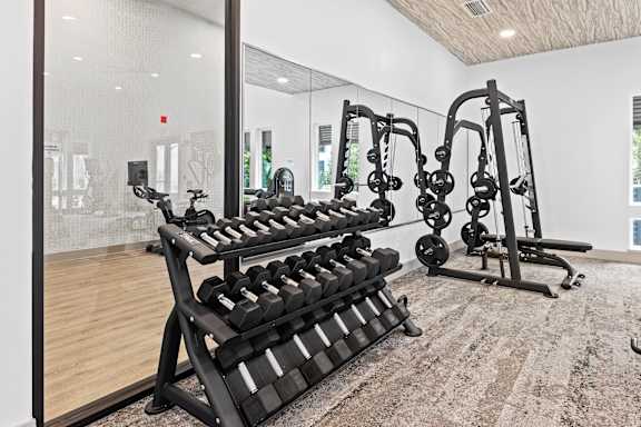 Gym with Rack of Weights at The Residences at Enso, Jacksonville, Florida