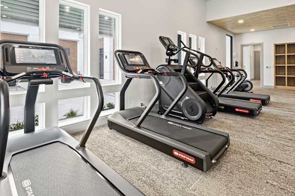 Modern Gym with Treadmill and Elliptical at The Residences at Enso, Jacksonville