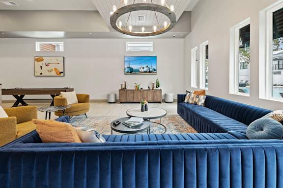 Modern Living Room with Blue Couch at The Residences at Enso, Jacksonville, FL