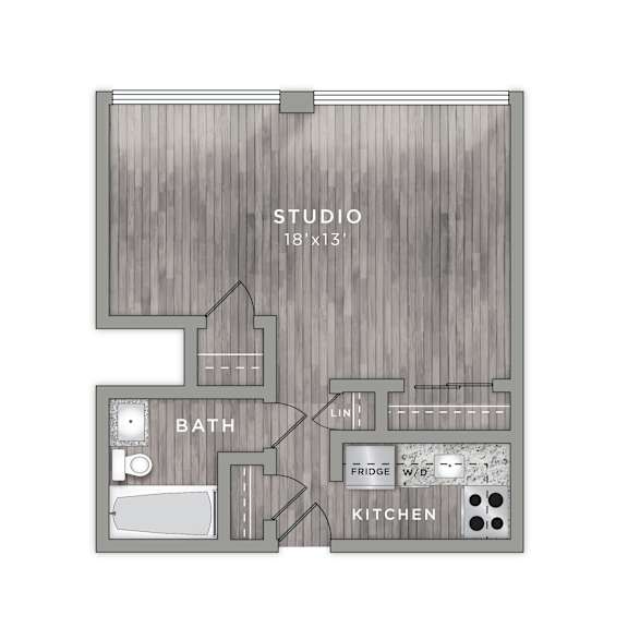 A floor plan of a studio apartment with a bath, kitchen, and studio space.