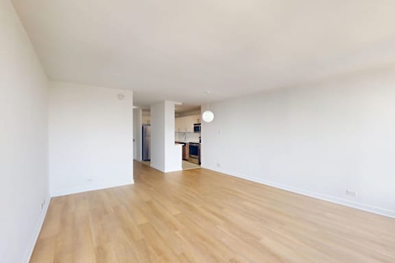 A room with wooden floors and white walls.