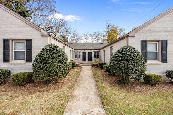 Floor Plan  A house with a grey siding and black shutters is surrounded by green bushes.at Raleigh Rentals, Raleigh, NC, 27604