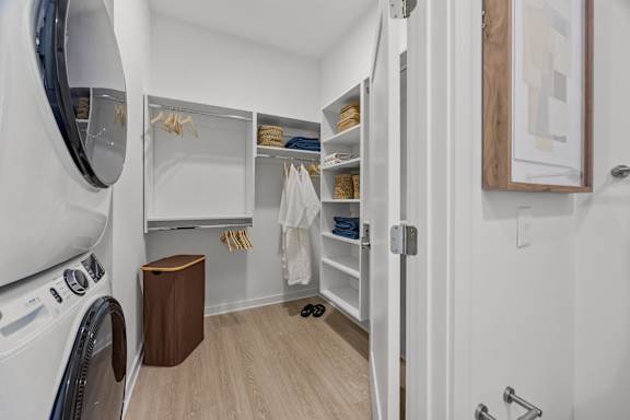 A small laundry room with a washer and dryer.