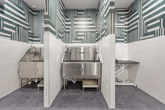 A kitchen with a large stainless steel sink and a counter.at Adler Montford Park + Drexel Townes, North Carolina, 28209