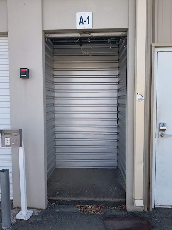 A white door with a sign above it that says A-1.