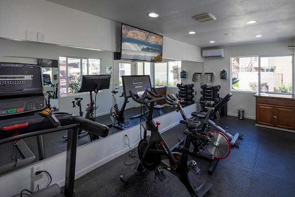 Fitness center with spin bikes and treadmill at Bella Del Mar Apartments, Del Mar