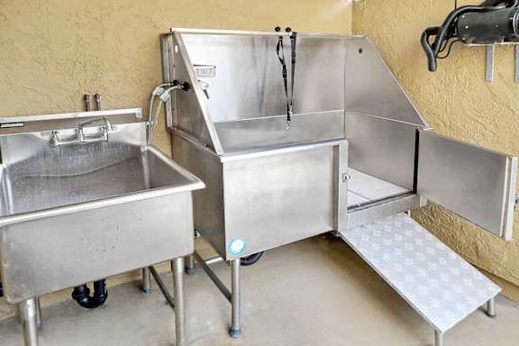 Commercial dog washing station with stainless steel tub at Bella Del Mar Apartments, California