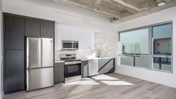 Kitchen with stainless steel fridge