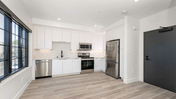 Kitchen with stainless steel fridge