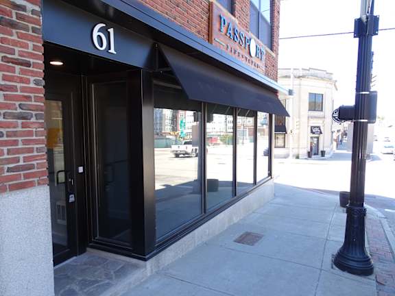 The exterior of a building with the number 61 on it.