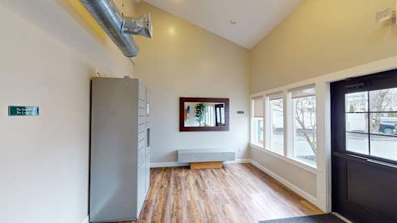 Entryway with builtin bench and hardwood flooring at Bostonian Shoe Lofts Apartments, Whitman, 02382