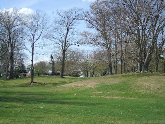Park with statue monument and mature trees 1 at Bostonian Shoe Lofts Apartments, Whitman, Massachusetts