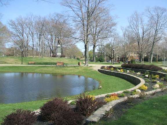 Park with pond curved garden beds and benches 1 at Bostonian Shoe Lofts Apartments, Whitman