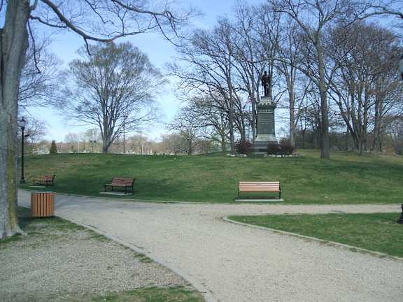 Monument in park with walking paths and benches at Bostonian Shoe Lofts Apartments, Massachusetts