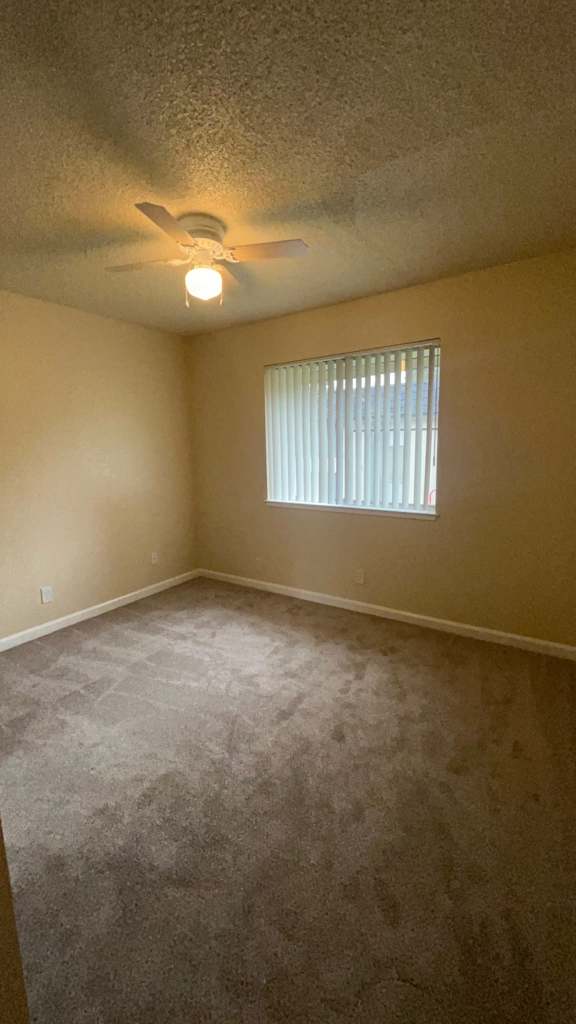 Room with a ceiling fan  at Vacaville Park Apartments, Vacaville, 95687