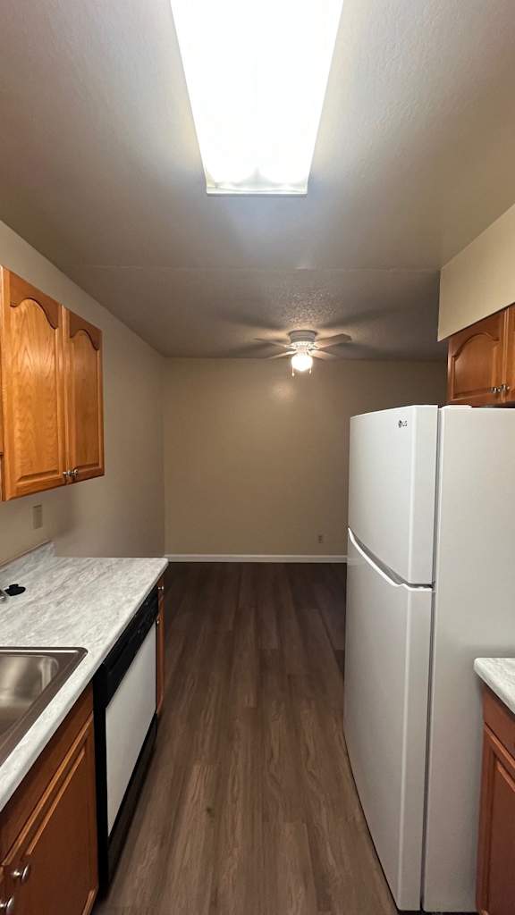 Kitchen with wooden cabinets at Vacaville Park Apartments, Vacaville, 95687