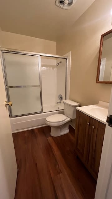 Bathroom with a toilet, sink, and shower at Vacaville Park Apartments, Vacaville