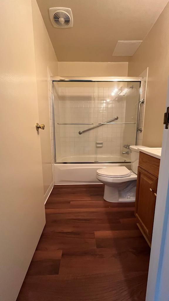 Bathroom with wood flooring at Vacaville Park Apartments, California