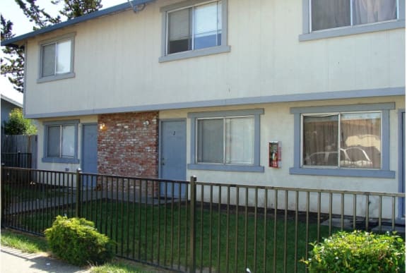 a house with a fence in front of it