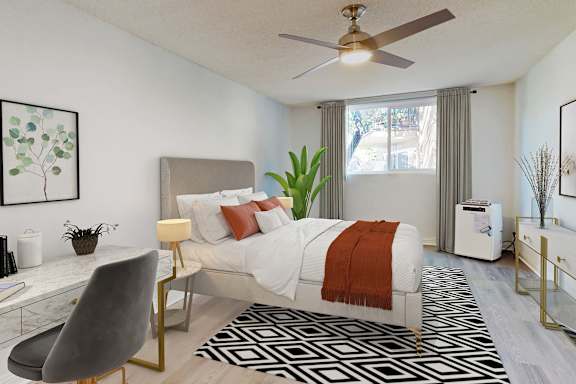 A modern bedroom with a large bed and a ceiling fan at Casa Granada, California, 90049