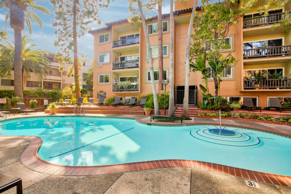 a large swimming pool in front of an apartment building at Casa Granada, Los Angeles, CA, 90049